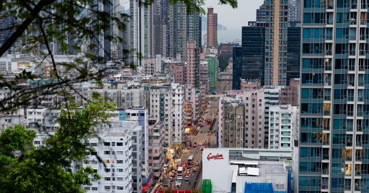 Traffic on the several-laned road between the buildings of Garden Hill