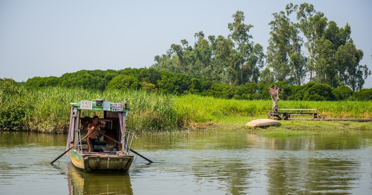 The traditional boat crosses the river at Nam Sang Wai.