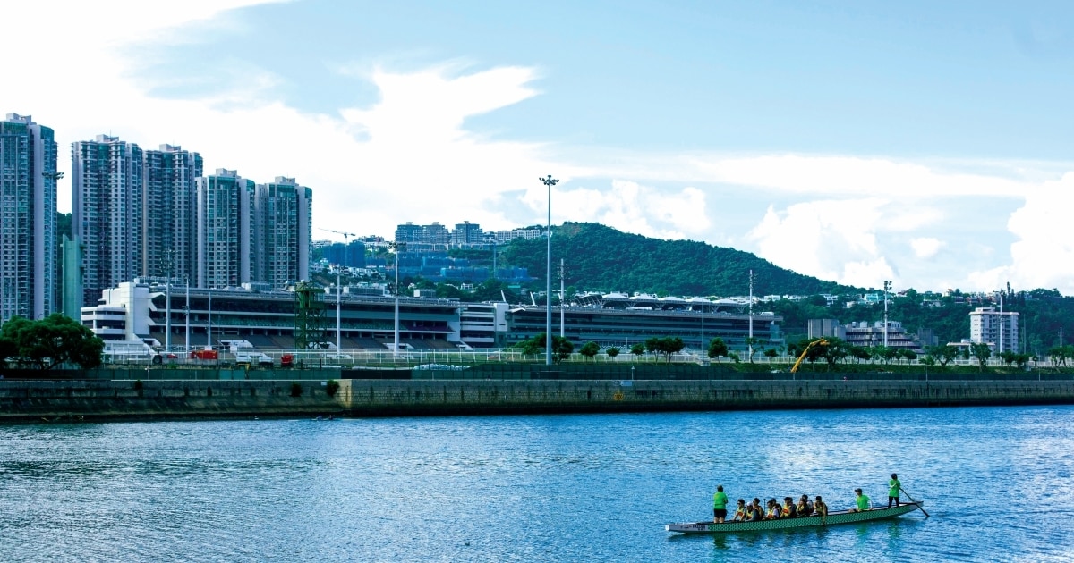 A view of Shing Mun River in Sha Tin with buildings in the background.